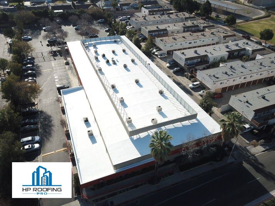 An aerial view of a building with a white roof.