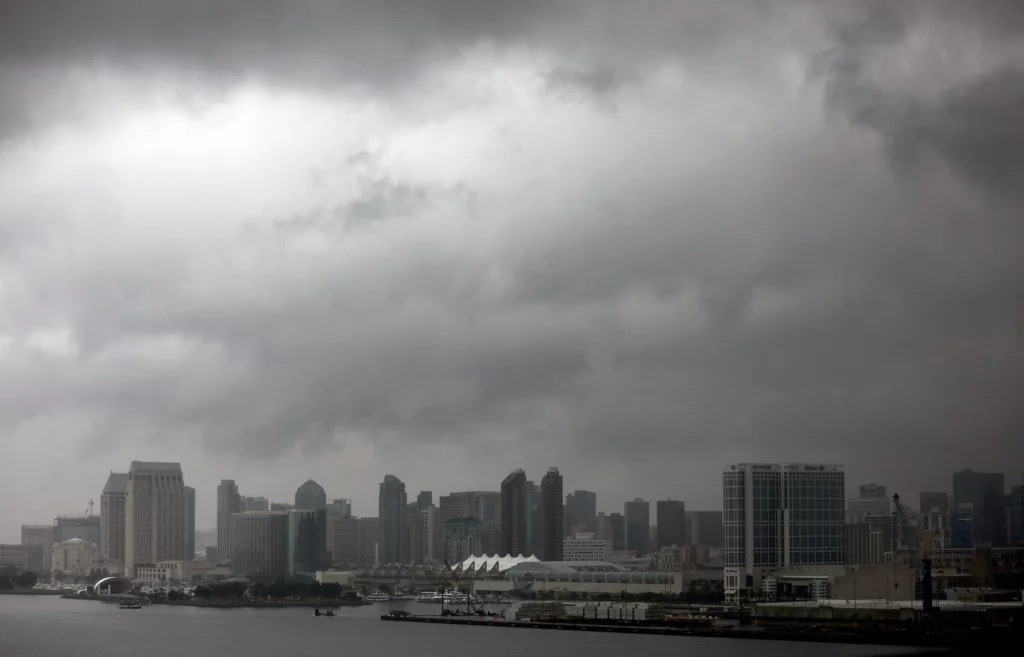 San diego's skyline under a cloudy sky.