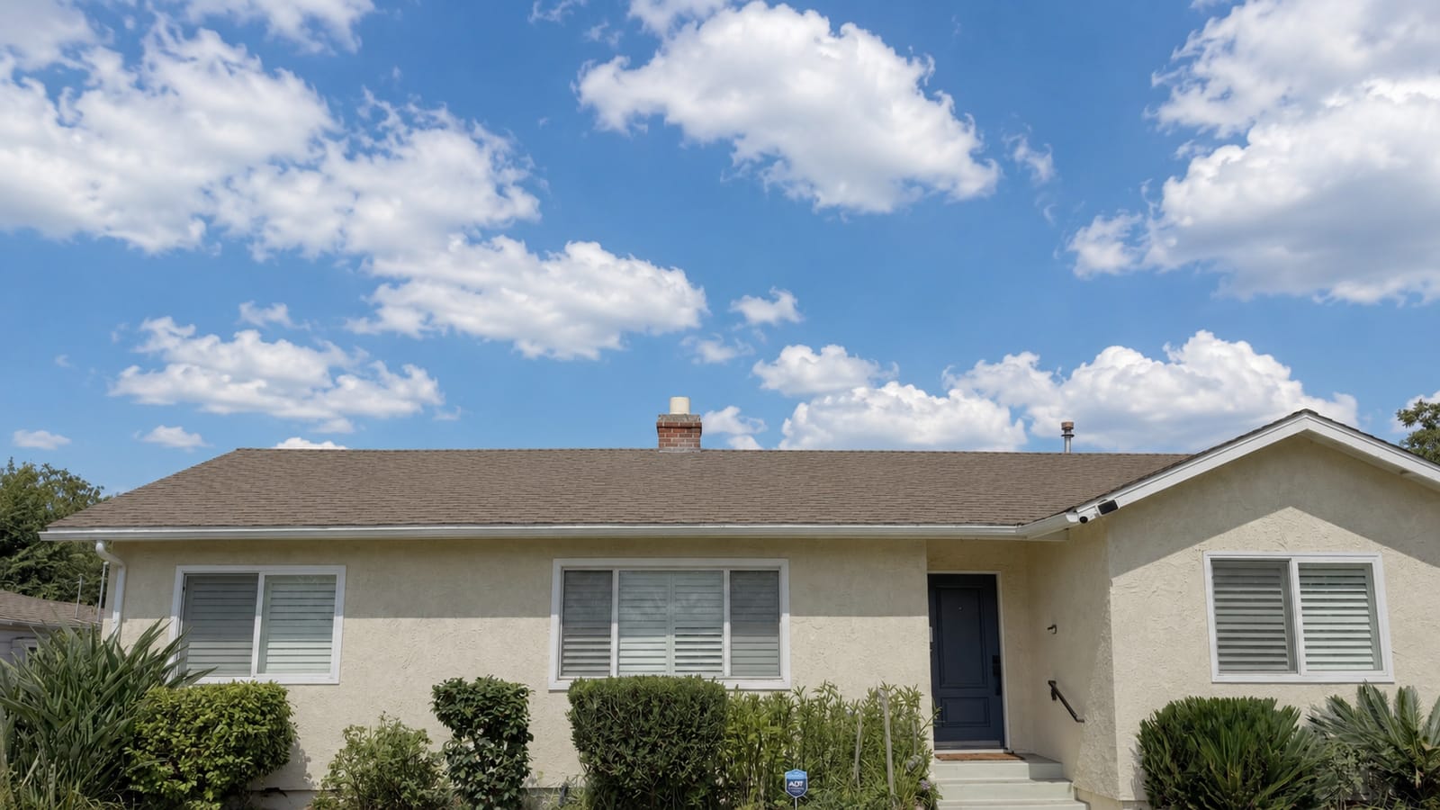 Reflective elastomeric acrylic coating applied to a residential shingle roof in Southern California